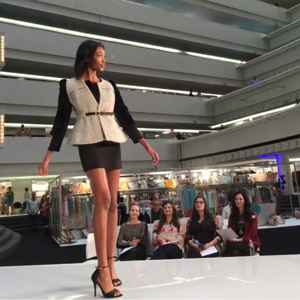 Brand new Jacket. Dark grey with faux leather and fur accents.